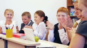 Schoolchildren clapping-in-the-classroom